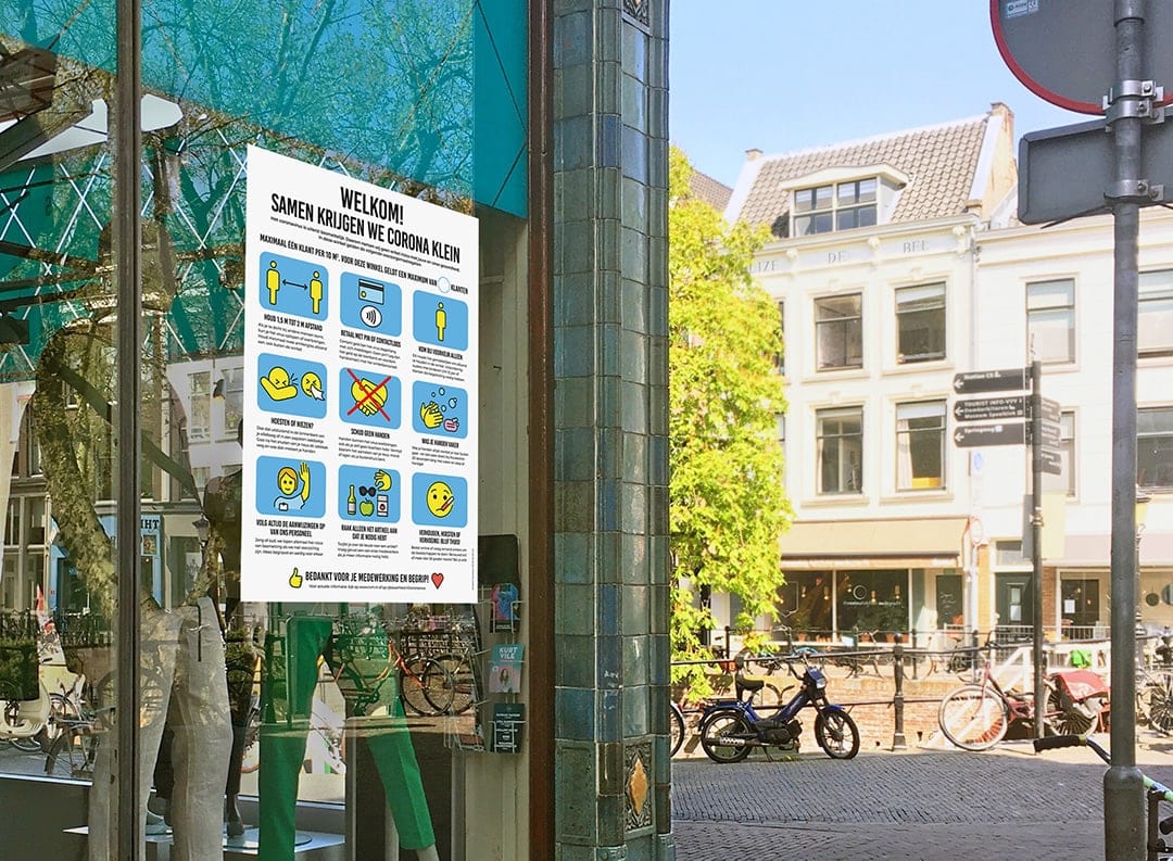 Coronaposter op winkeletalage met preventiemaatregelen